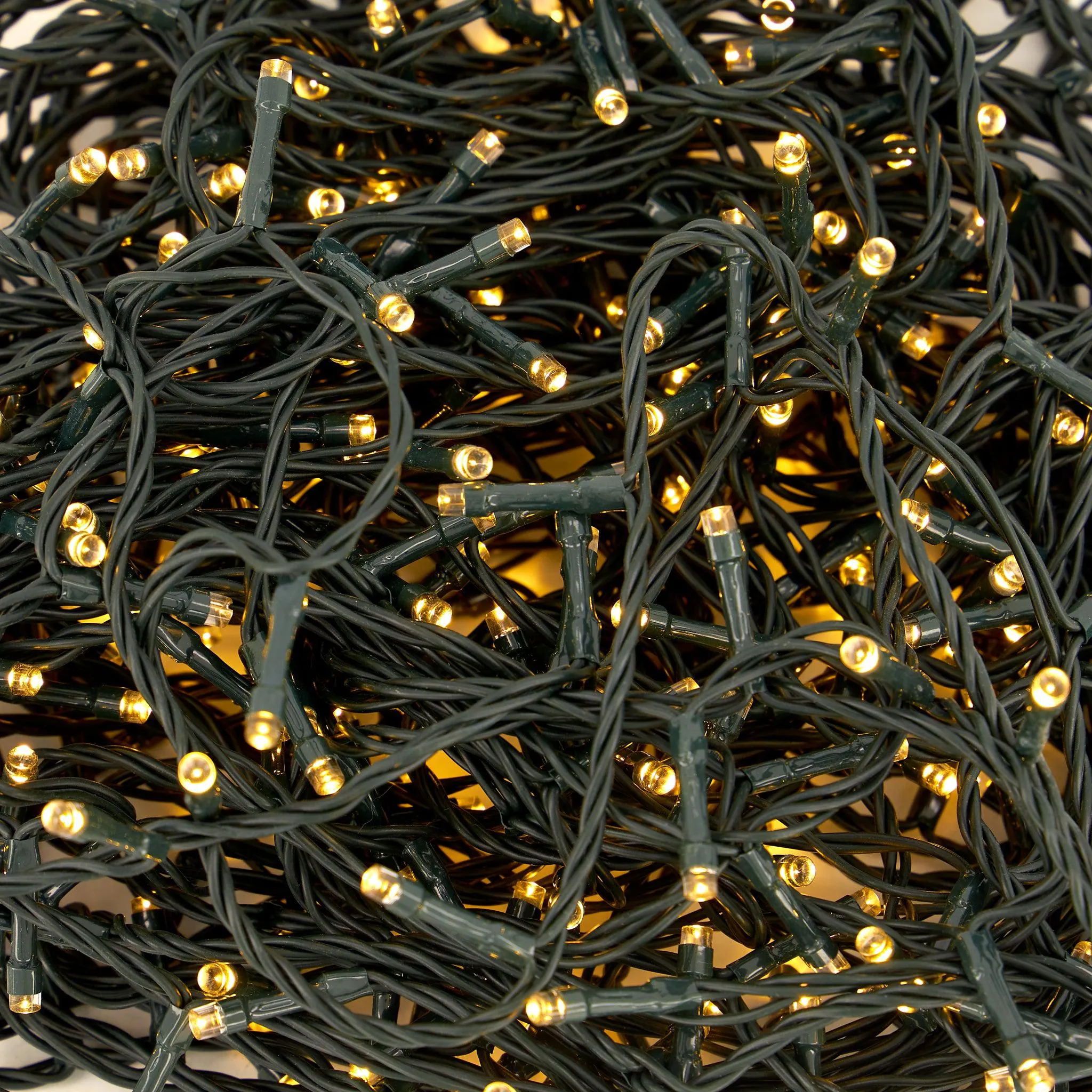 Indoor/Outdoor 8 Function LED Waterproof Fairy Lights with Green Cable (200 Lights - 18M Cable) - Warm White Lights